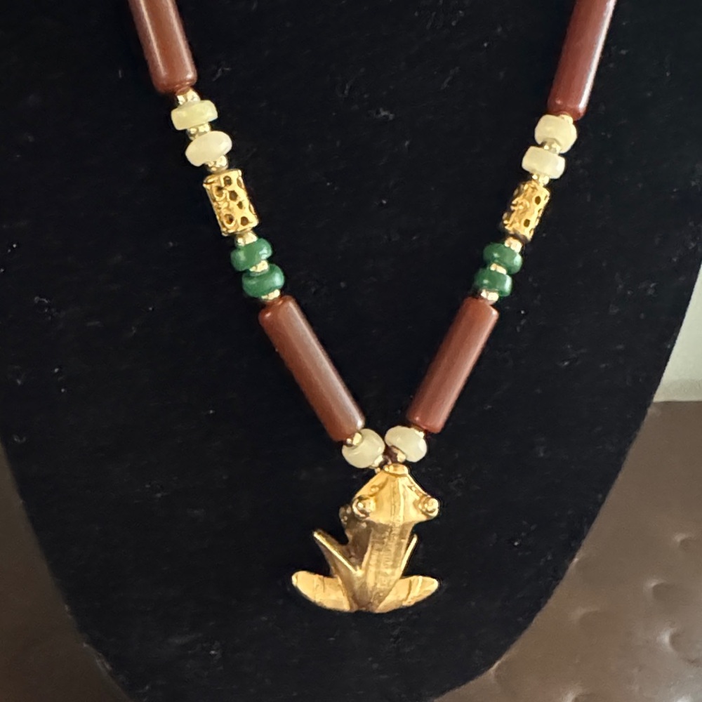 Reproduction Columbian indigenous art Brass Frog pendant on faux jade like tubes